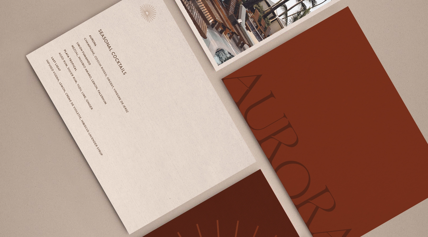 Aurora Villas and Suites wordmark in gold on a deep purple background with a subtle sunburst